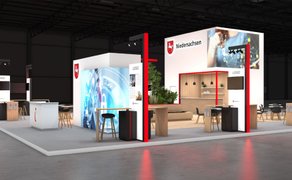 Grafik eines modernen Messestands mit dem Schriftzug „Niedersachsen“ und mehreren Sitzbereichen in einer Halle.