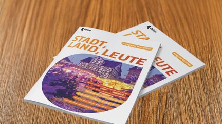 Das Bild zeigt zwei Stadtmagazine Stadt, Land, Leute die auf einem Tisch liegen. 